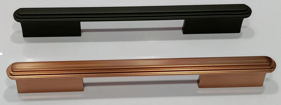 Two decorative cabinet pulls shown on a plain light background: a matte black pull at the top and a copper-toned pull at the bottom.